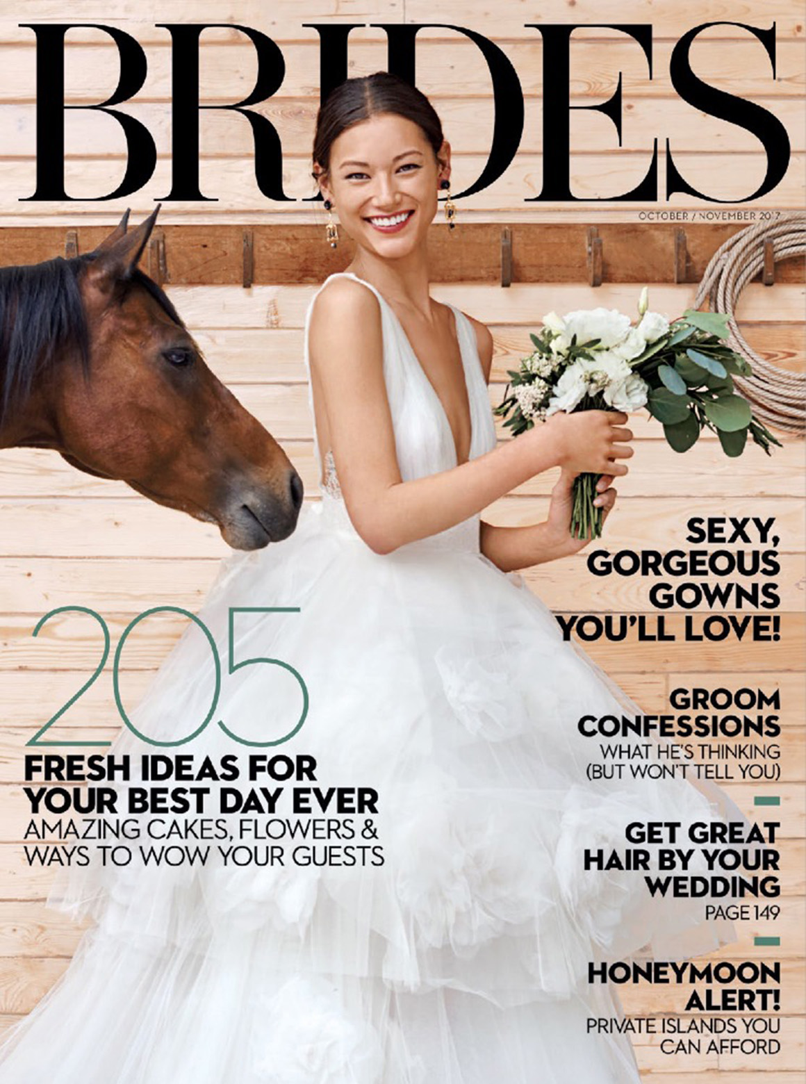 Cover of Brides Magazine featuring a bride in a barn holding a bouquet with a horse behind her. The October 2017 issue is titled "205 Fresh ideas for your best day ever."